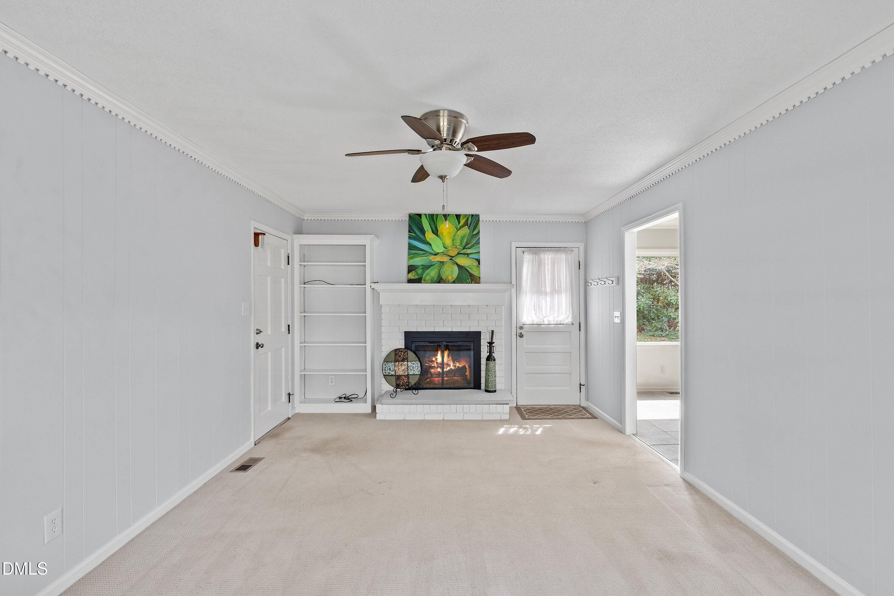 400 Cedar Hill Lane Raleigh, NC 27609 - Photo 23 of 41 a view of a livingroom with a fireplace and window