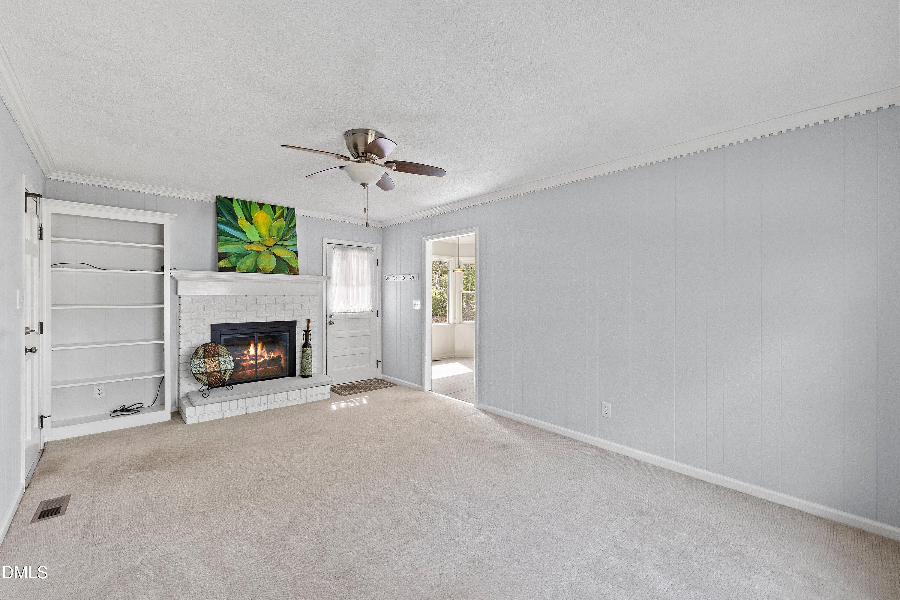 400 Cedar Hill Lane Raleigh, NC 27609 - Photo 24 of 41 a view of a livingroom with a fireplace and a window