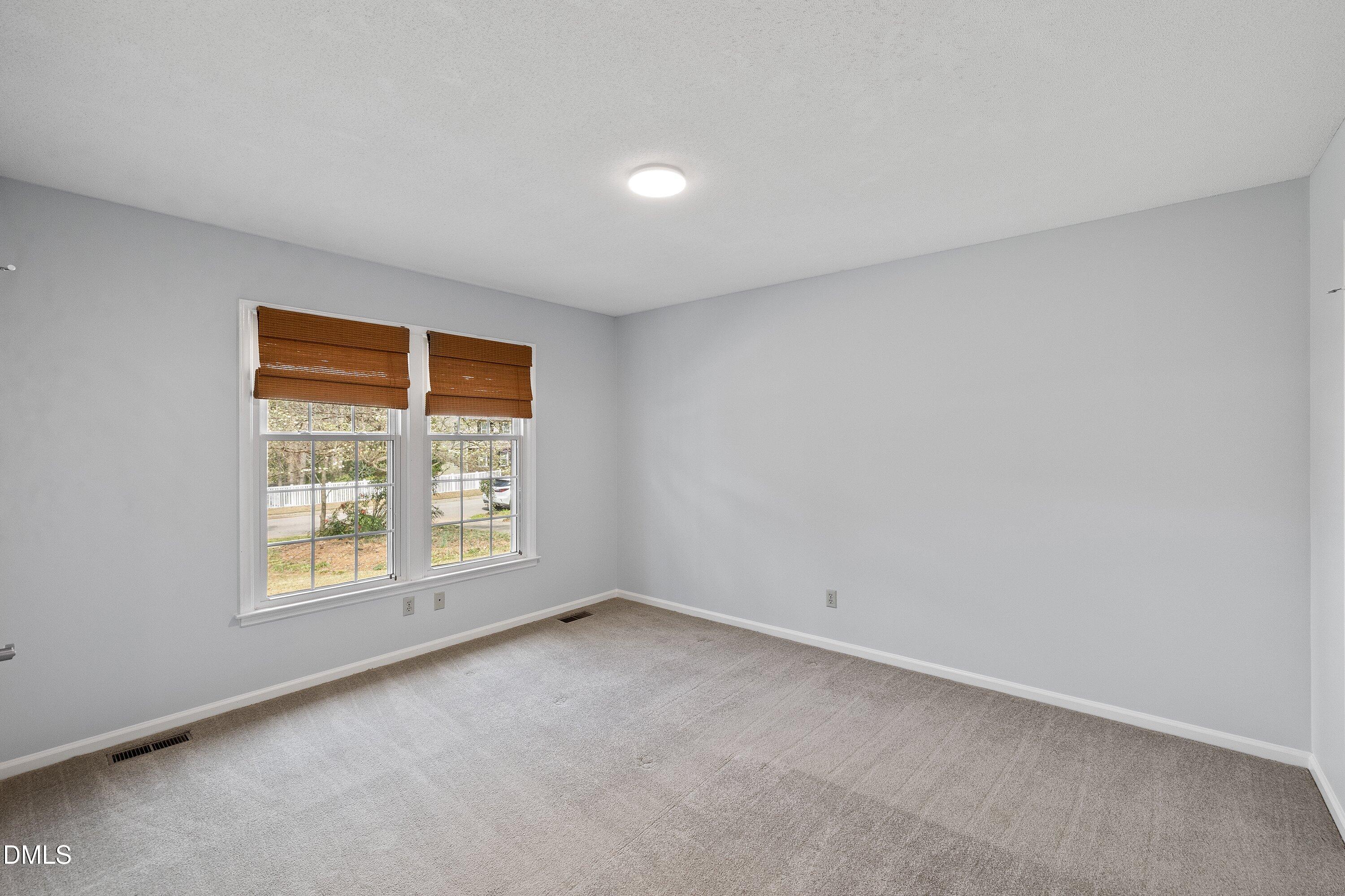 400 Cedar Hill Lane Raleigh, NC 27609 - Photo 26 of 41 an empty room with a window