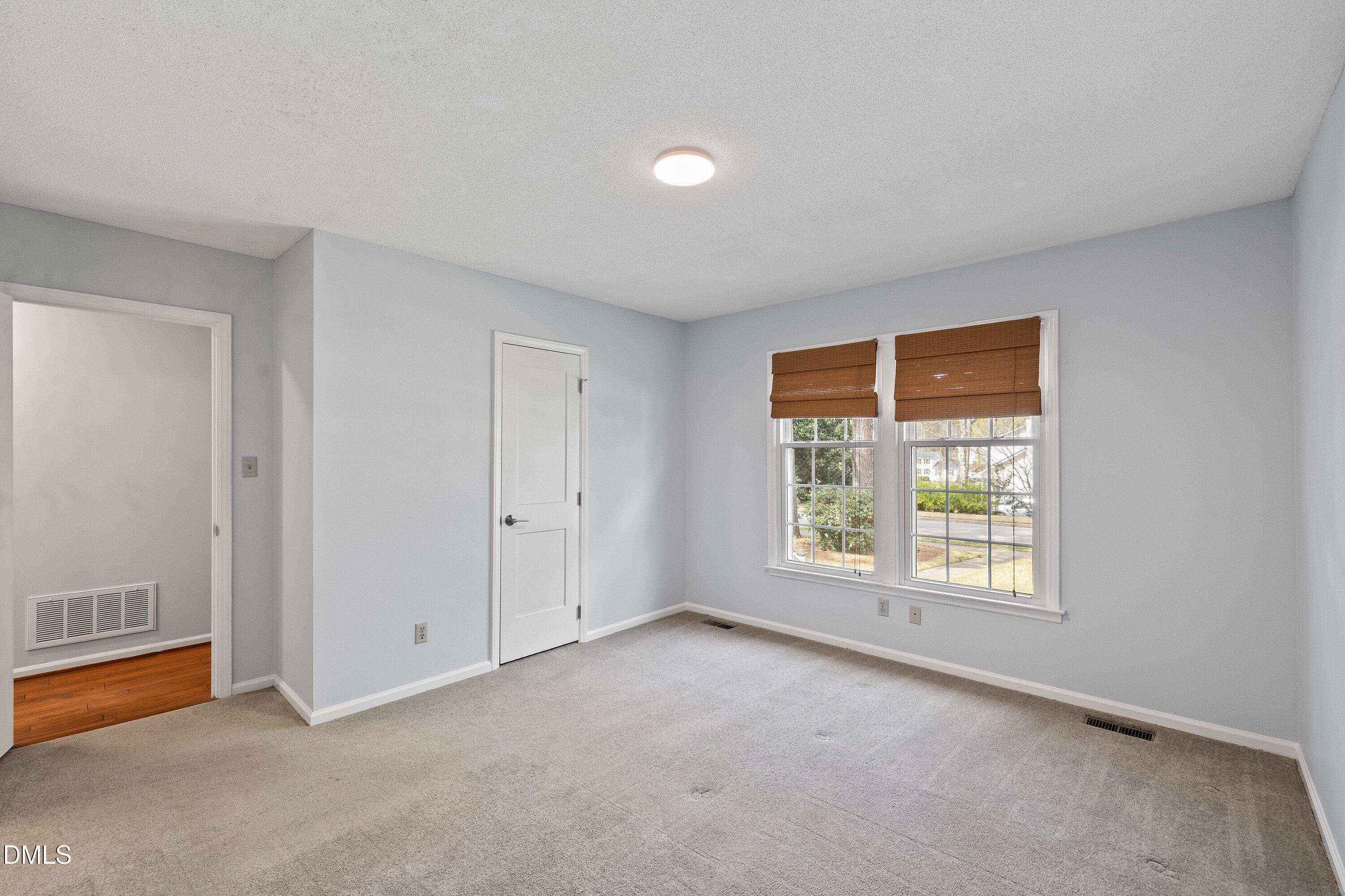 400 Cedar Hill Lane Raleigh, NC 27609 - Photo 28 of 41 an empty room with windows