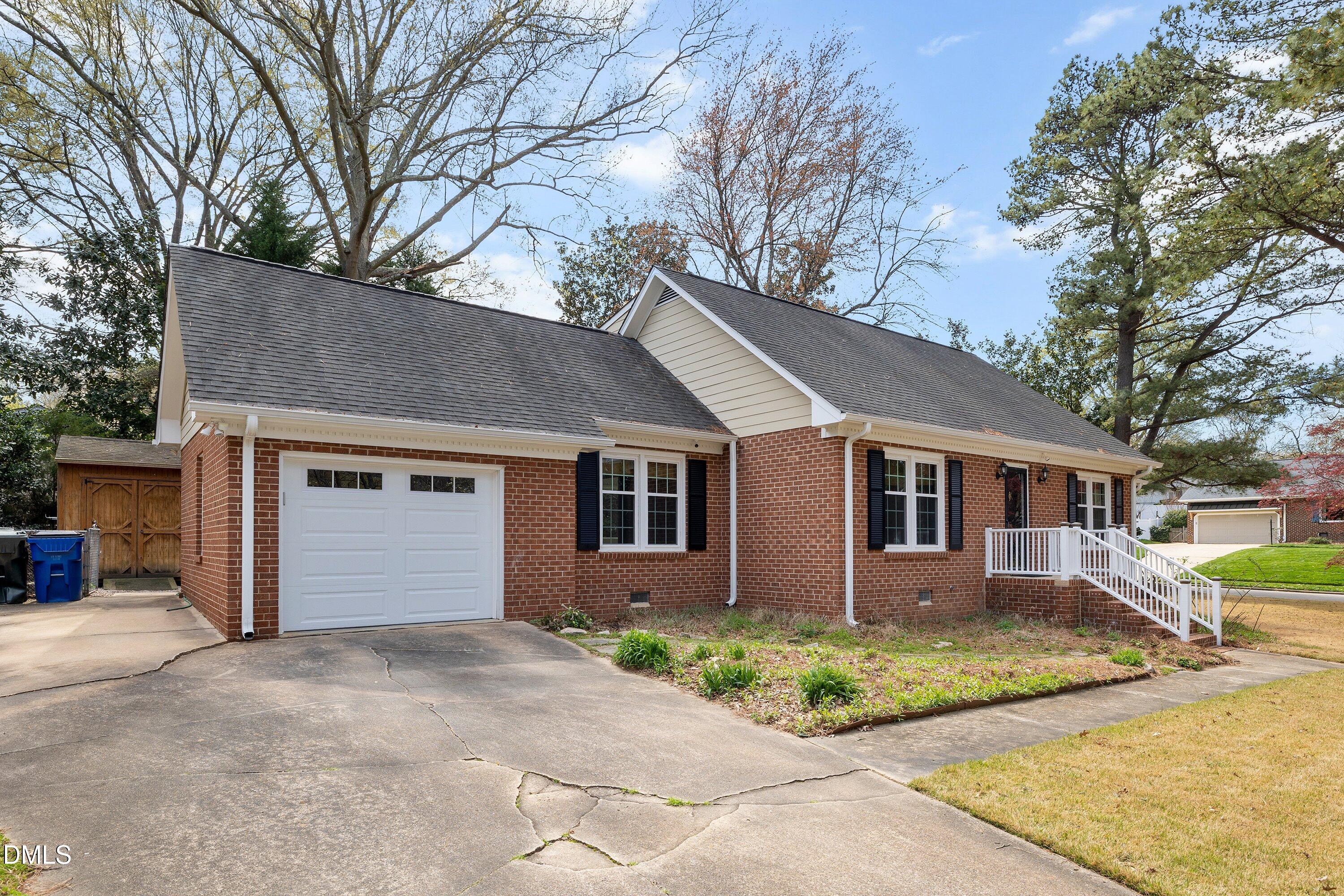 400 Cedar Hill Lane Raleigh, NC 27609 - Photo 3 of 41 a front view of house with yard and trees around