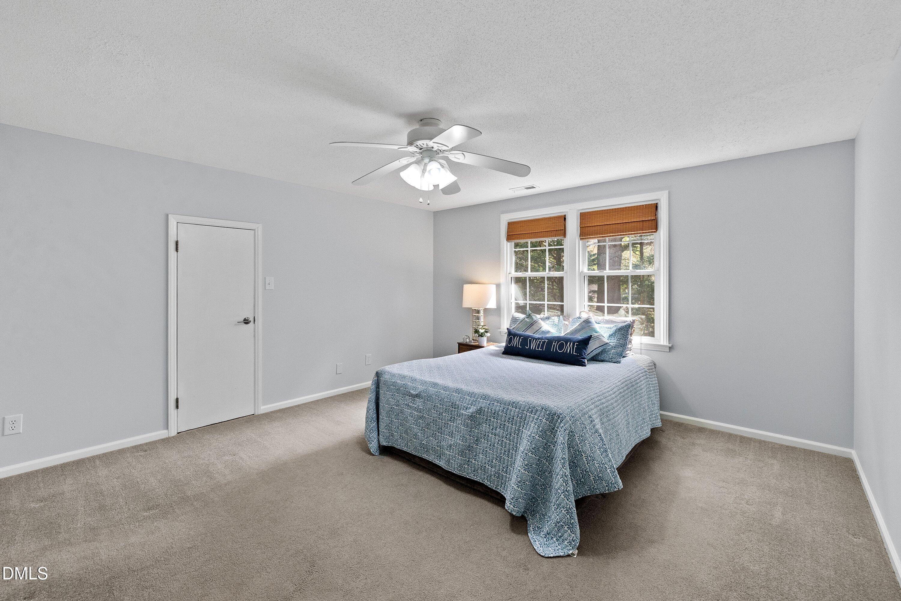 400 Cedar Hill Lane Raleigh, NC 27609 - Photo 34 of 41 a bedroom with a bed and window