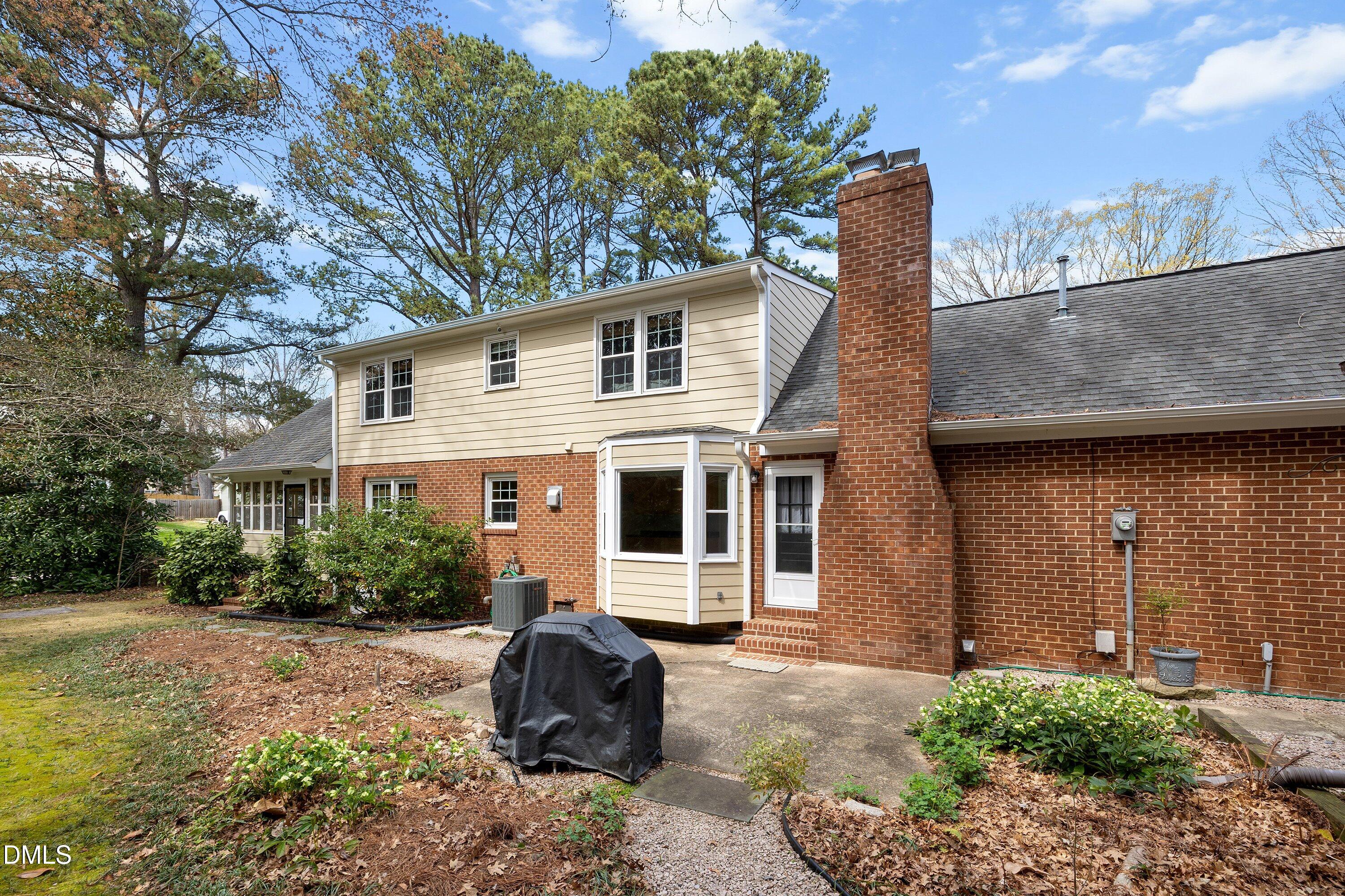 400 Cedar Hill Lane Raleigh, NC 27609 - Photo 40 of 41 a front view of a house with a yard