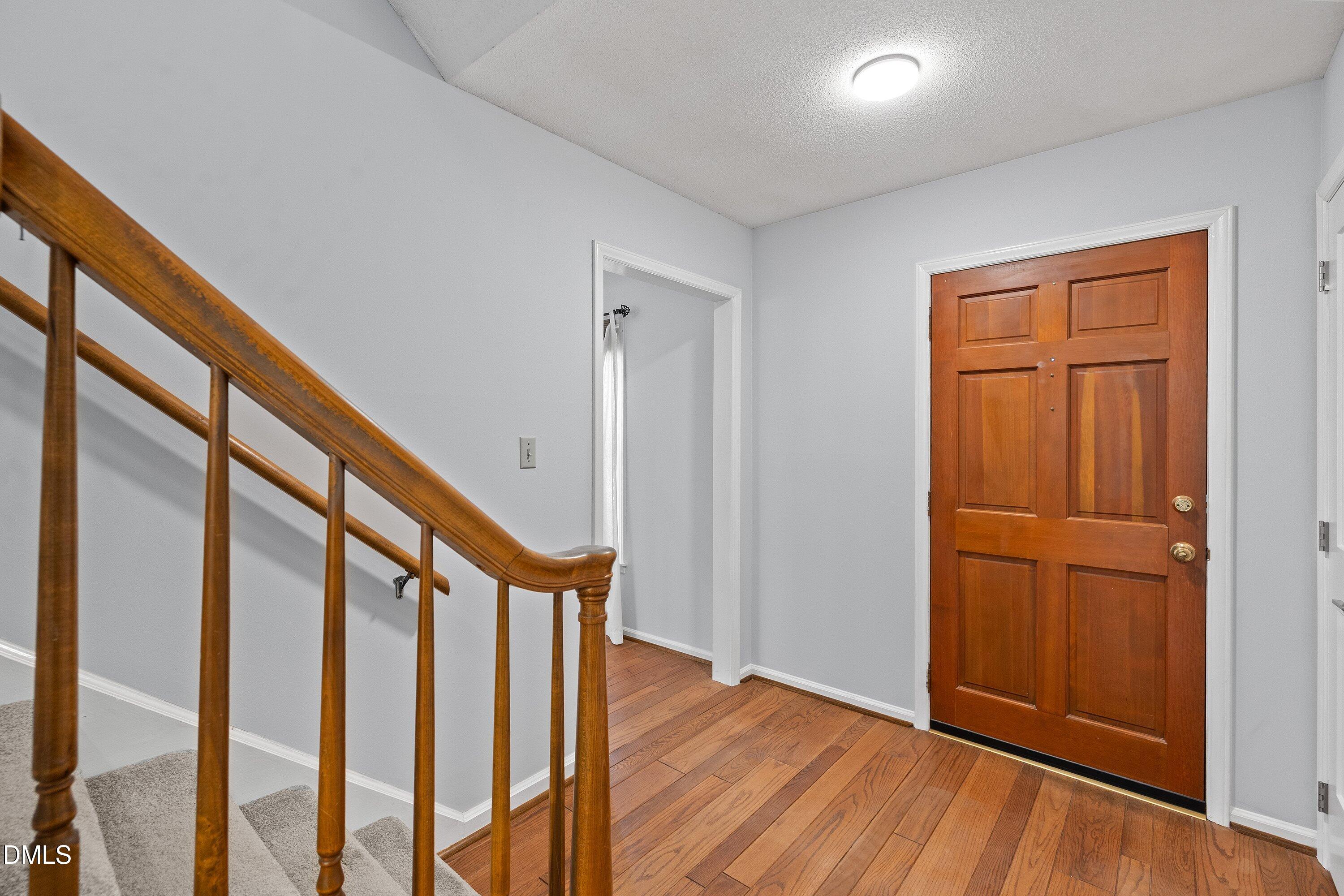 400 Cedar Hill Lane Raleigh, NC 27609 - Photo 4 of 41 a view of an entryway with wooden floor