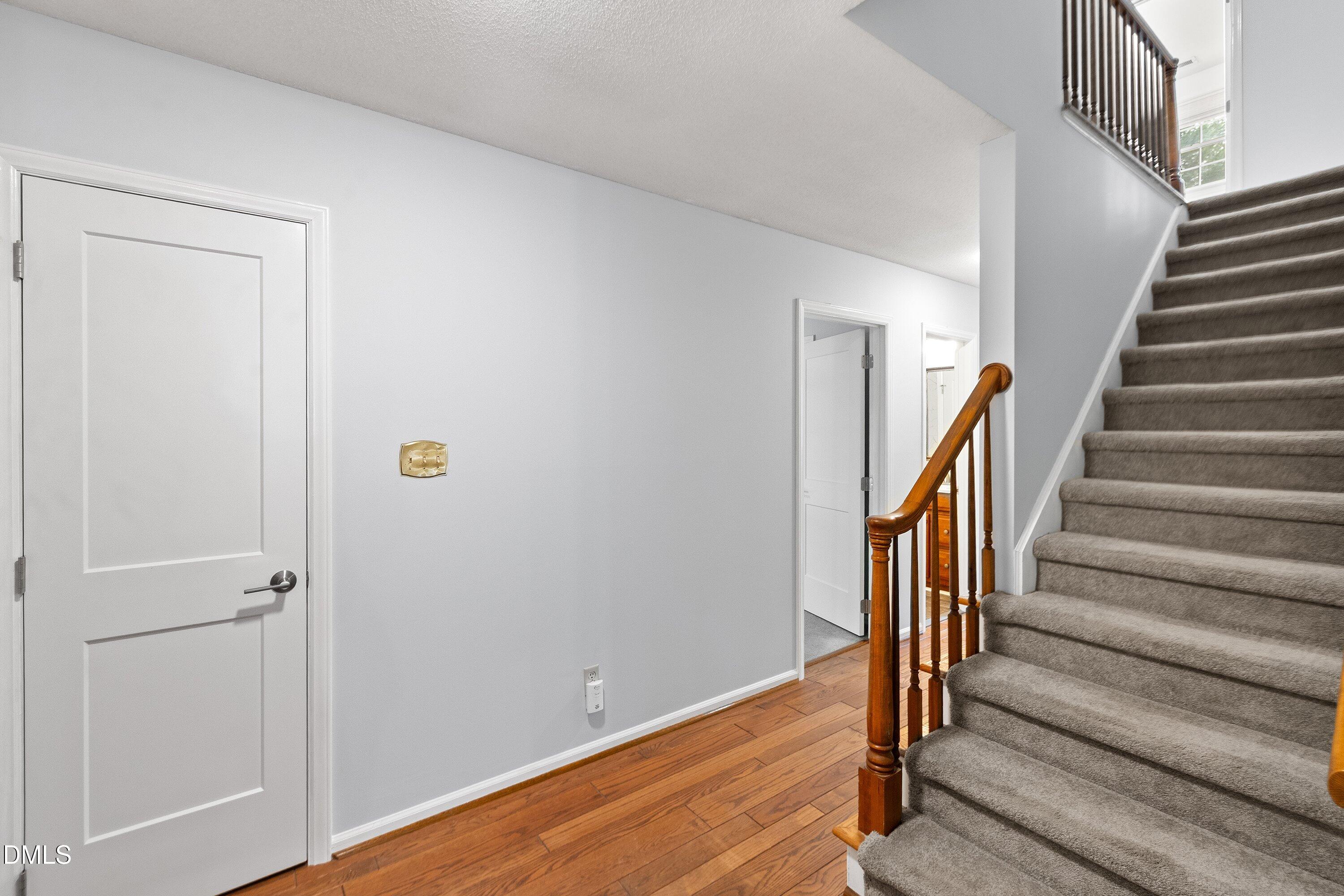 400 Cedar Hill Lane Raleigh, NC 27609 - Photo 6 of 41 a view of entryway with wooden floor