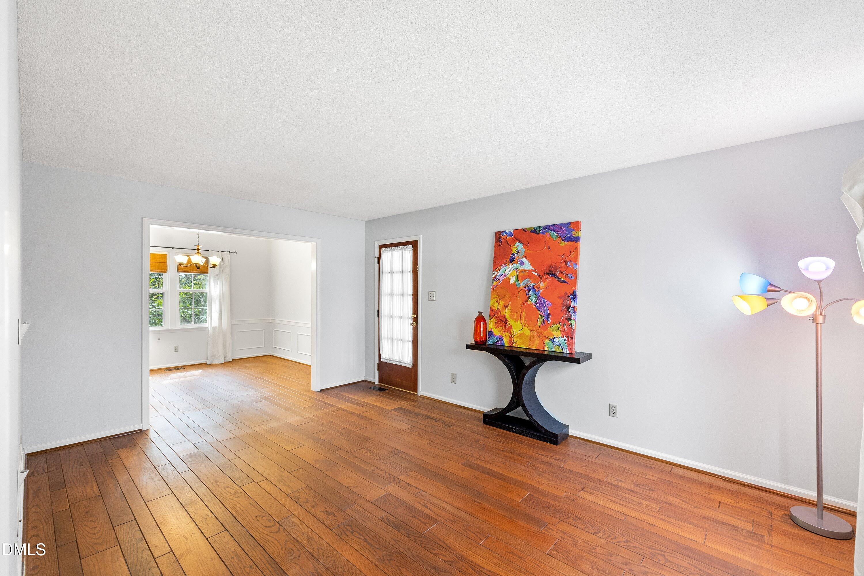 400 Cedar Hill Lane Raleigh, NC 27609 - Photo 7 of 41 a view of empty room with wooden floor