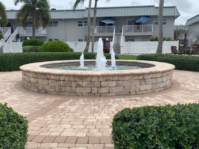 6777 Winkler Road, Unit 273 Fort Myers, FL 33919 - Photo 25 of 32 a view of a house with backyard and sitting area