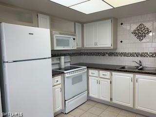 6777 Winkler Road, Unit 273 Fort Myers, FL 33919 - Photo 4 of 32 a kitchen with granite countertop white cabinets and white appliances