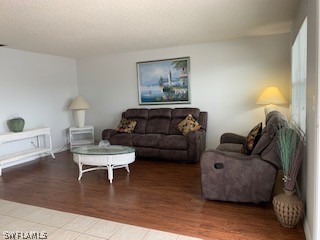 6777 Winkler Road, Unit 273 Fort Myers, FL 33919 - Photo 10 of 32 a living room with furniture and a wooden floor
