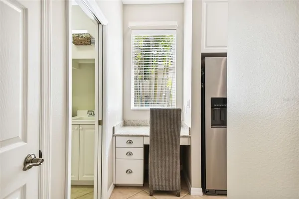 a kitchen with stainless steel appliances granite countertop a stove and white cabinets
