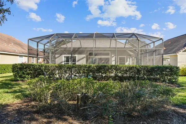 a front view of a house with a yard and outdoor seating