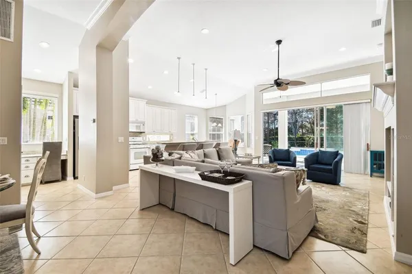 a dining room with furniture a rug and wooden floor