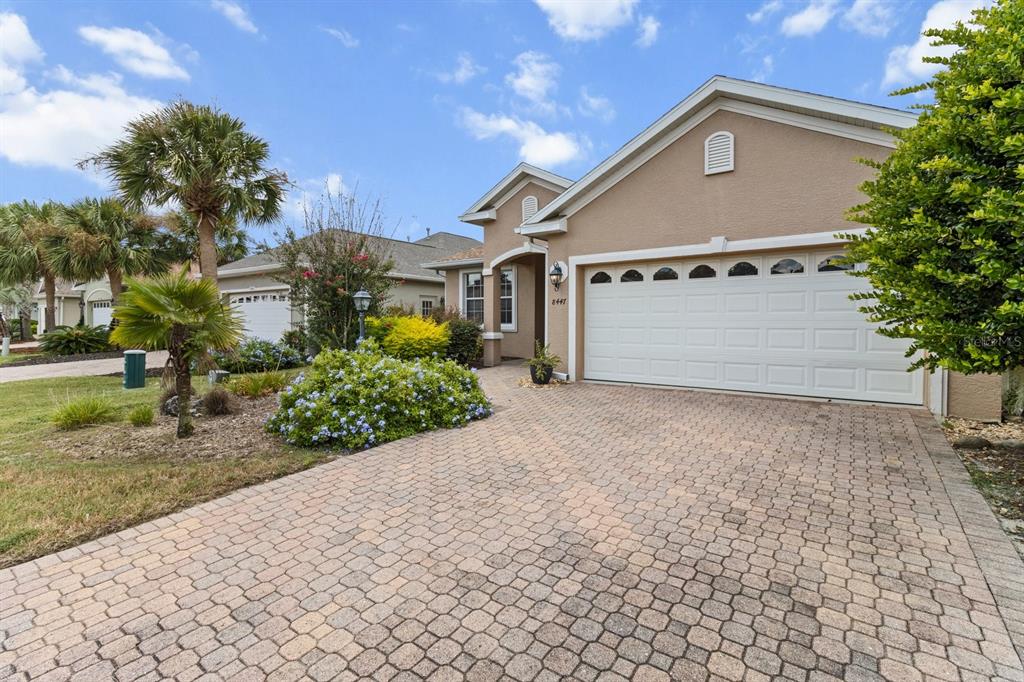 8447 Southwest 82nd Loop Ocala, FL 34481 - Photo 1 of 1 a view of a house with a yard and potted plants
