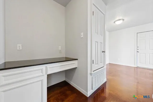 a hallway with wooden floor