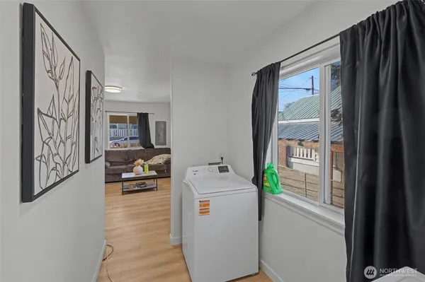 a utility room with closet dryer and washer