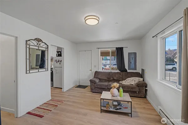 a living room with furniture and a window
