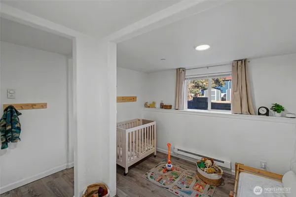 a bedroom with furniture and a window