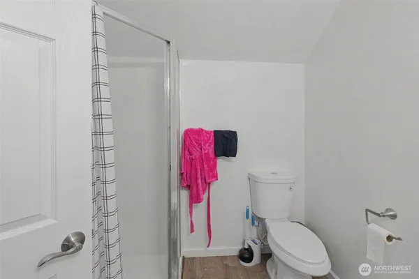 a white toilet sitting next to a bathroom sink