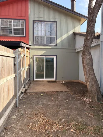 a view of a house with a yard and garage