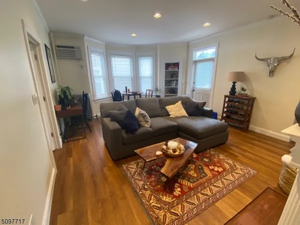 a living room with furniture and a rug