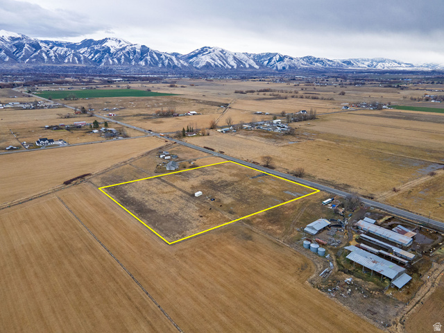 3285 West 600 South Logan, UT 84321 - Photo 12 of 16 Aerial view of sparsely populated area with property boundaries highlighted and mountains