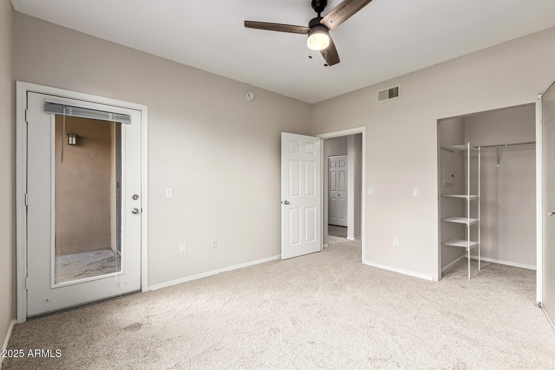 20100 North 78th Place, Unit 1064 Scottsdale, AZ 85255 - Photo 19 of 37 a view of empty room with a ceiling fan