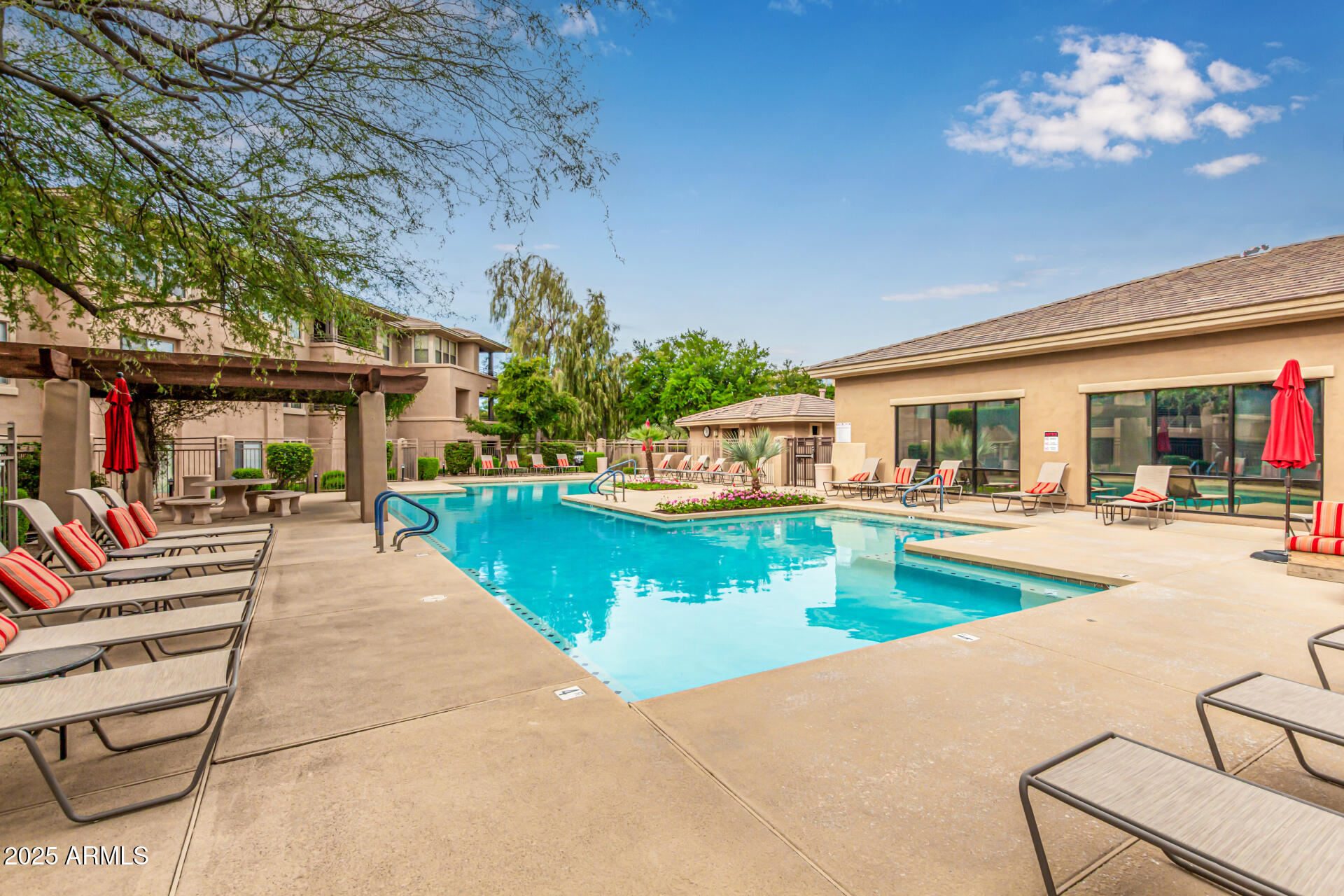 20100 North 78th Place, Unit 1064 Scottsdale, AZ 85255 - Photo 29 of 37 a view of a house with swimming pool and a porch with furniture