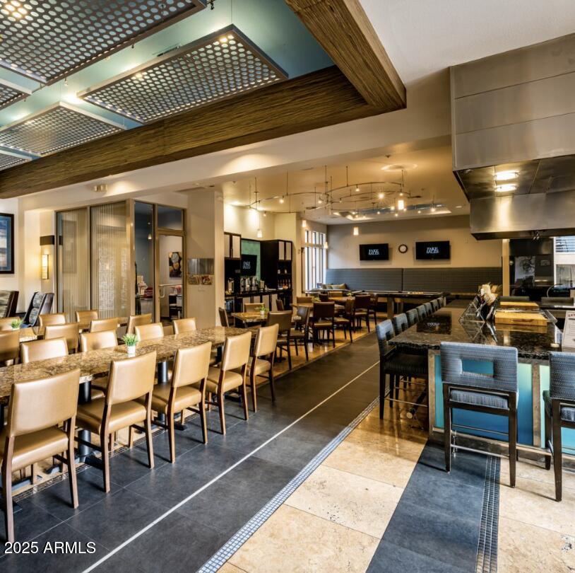 20100 North 78th Place, Unit 1064 Scottsdale, AZ 85255 - Photo 32 of 37 a group of people sitting in a large room