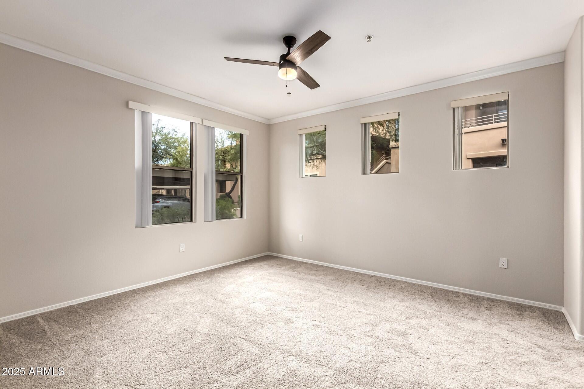 20100 North 78th Place, Unit 1064 Scottsdale, AZ 85255 - Photo 6 of 37 a view of an empty room with a window