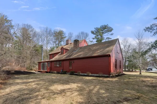 a view of a barn in the middle of a yard