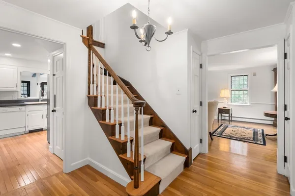 a view of a living room and wooden floor