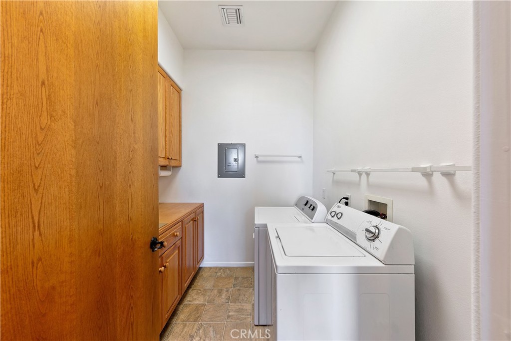 8400 Mipolomol Road Malibu, CA 90265 - Photo 20 of 59 a utility room with dryer and washer