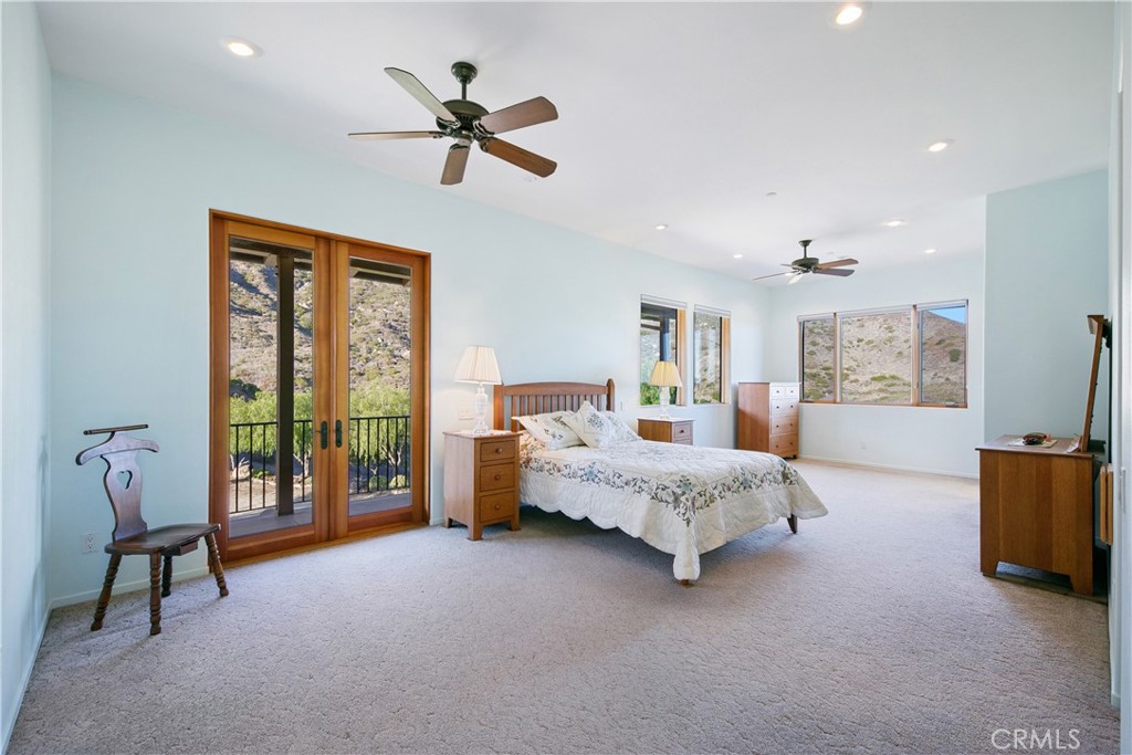 8400 Mipolomol Road Malibu, CA 90265 - Photo 29 of 59 a bed room with a bed and a tv