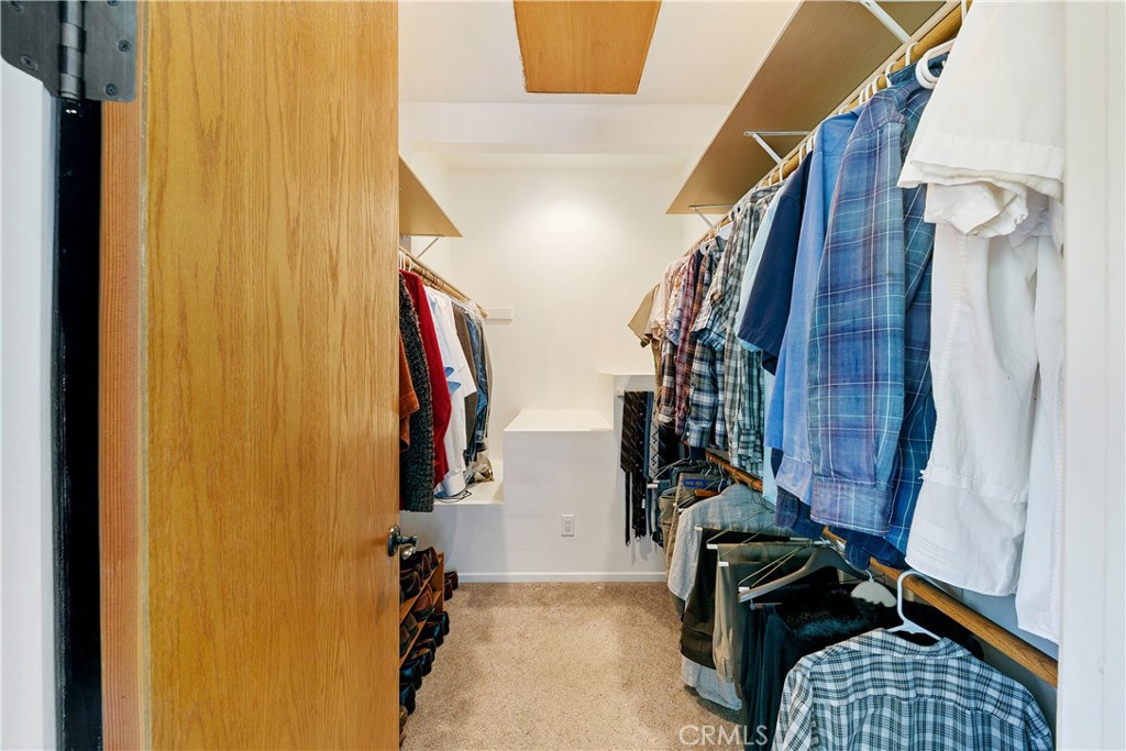 8400 Mipolomol Road Malibu, CA 90265 - Photo 35 of 59 a view of walk in closet with clothes