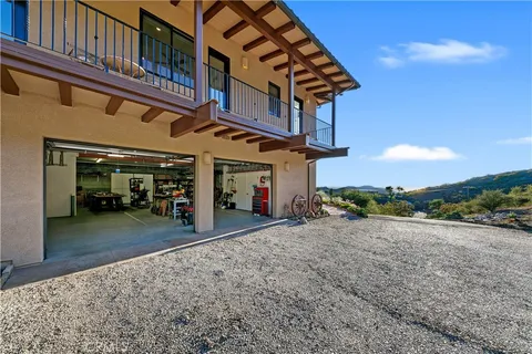 an aerial view of a house with swimming pool and big yard