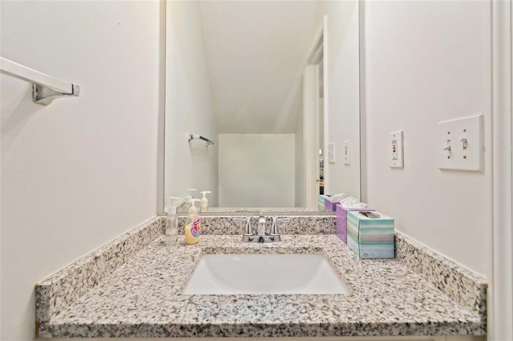3752 Berkeley Crossing Duluth, GA 30096 - Photo 12 of 23 a bathroom with a granite countertop sink and a mirror