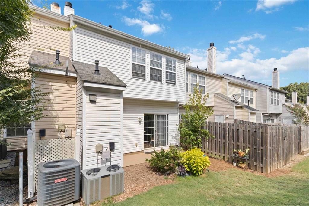 3752 Berkeley Crossing Duluth, GA 30096 - Photo 14 of 23 a view of a house with backyard and sitting area