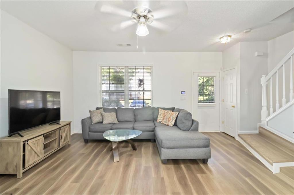 3752 Berkeley Crossing Duluth, GA 30096 - Photo 16 of 23 a living room with furniture and a flat screen tv