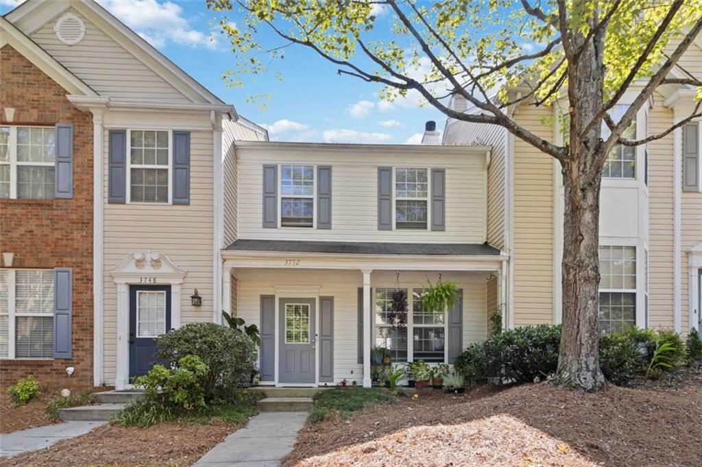 3752 Berkeley Crossing Duluth, GA 30096 - Photo 2 of 23 a front view of a house with garden