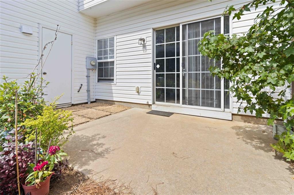 3752 Berkeley Crossing Duluth, GA 30096 - Photo 22 of 23 a view of a house with a yard and potted plants