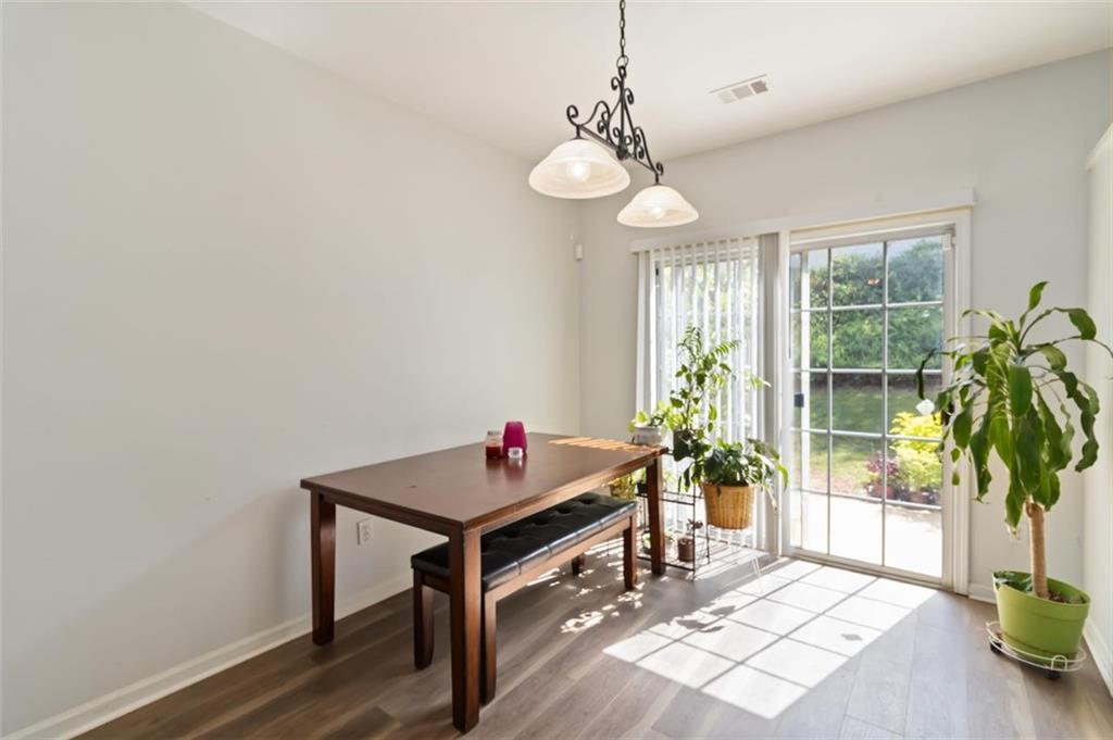3752 Berkeley Crossing Duluth, GA 30096 - Photo 7 of 23 a view of a dining room with furniture window and wooden floor