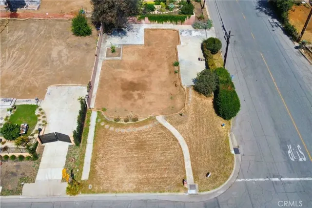 an aerial view of a house with a swimming pool