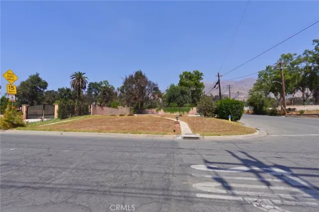 a view of a swimming pool with a yard