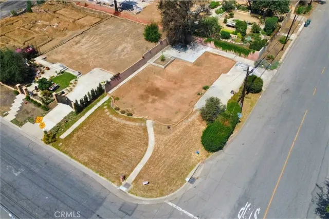 an aerial view of a house with a swimming pool