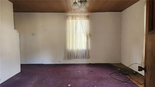a view of an empty room and window