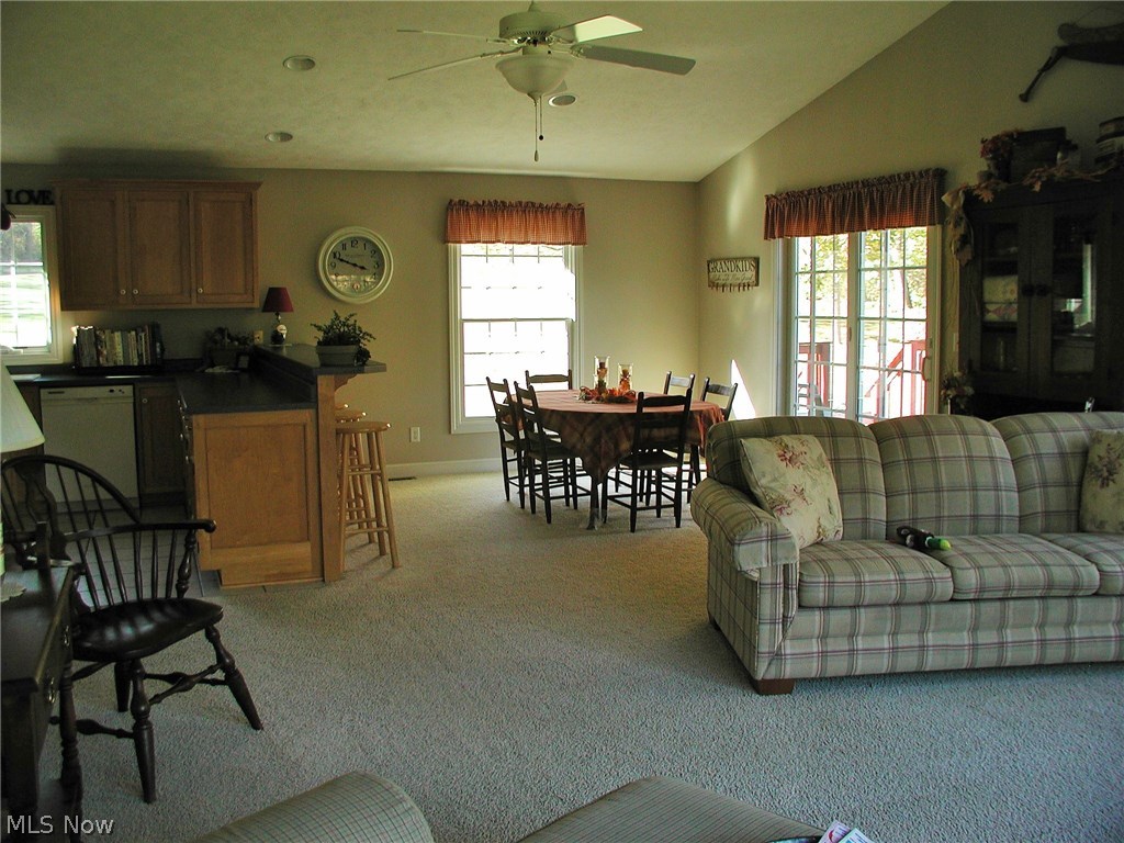 3020 Explorer Road Southwest Carrollton, OH 44615 - Photo 3 of 23 Great room with vaulted ceilings..Walk-out onto the back spacious deck