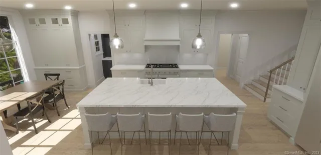 a large kitchen with a table and chairs