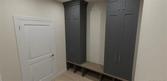 a picture of a brick wall with a white building