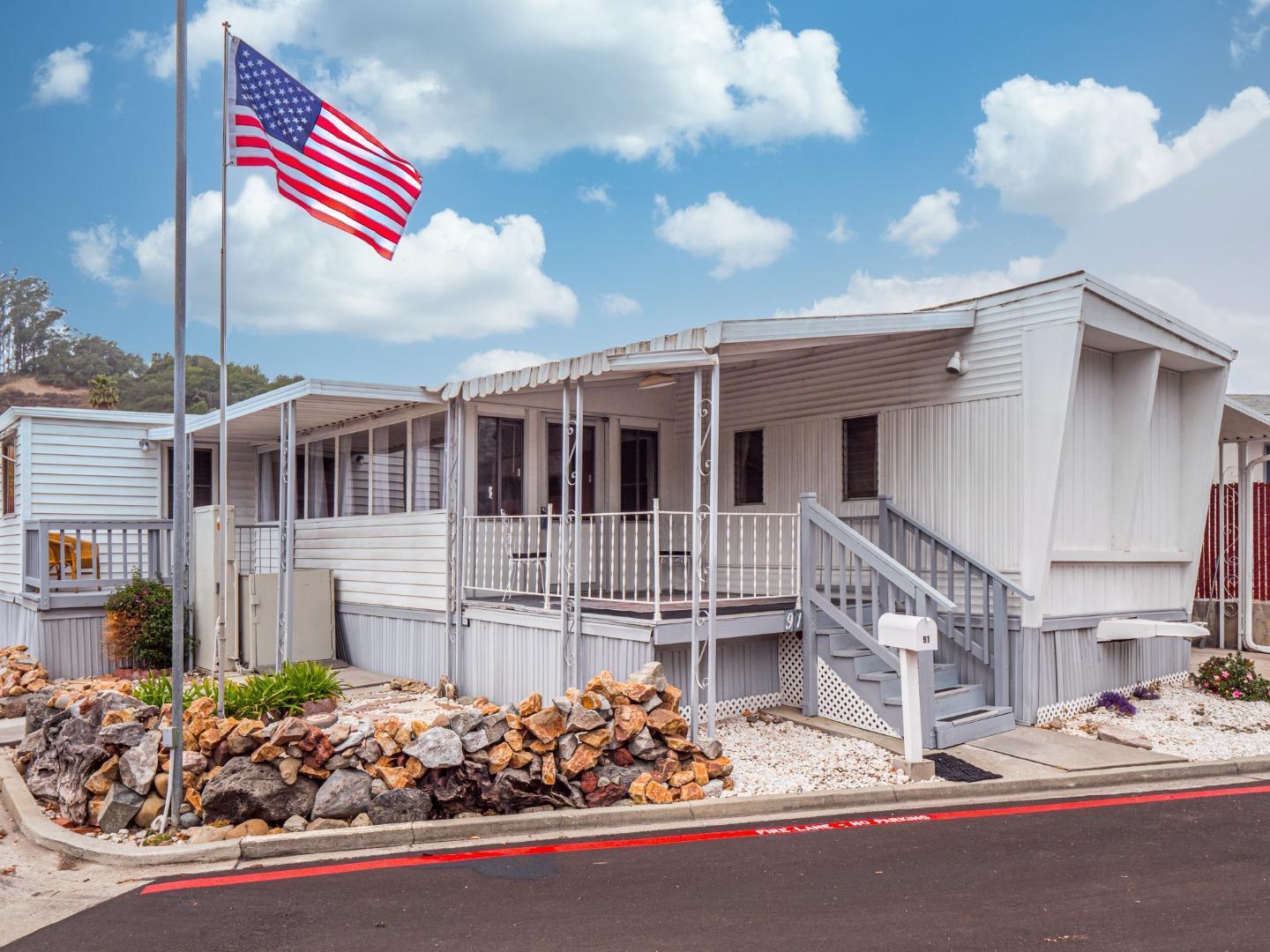 999 Old San Jose Road, Unit 91 Soquel, CA 95073 - Photo 1 of 1 a front view of a house with a street