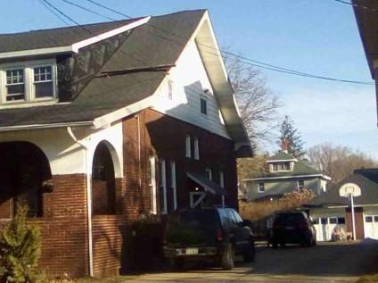 27 West Frederick Street Corry, PA 16407 - Photo 2 of 3 a front view of a house with parking area